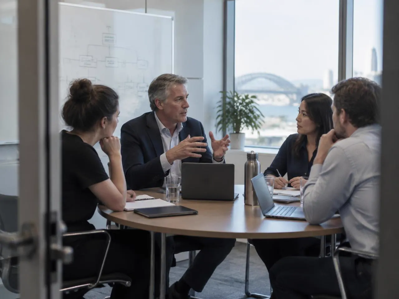 Colleagues discussing business operations around a meeting table